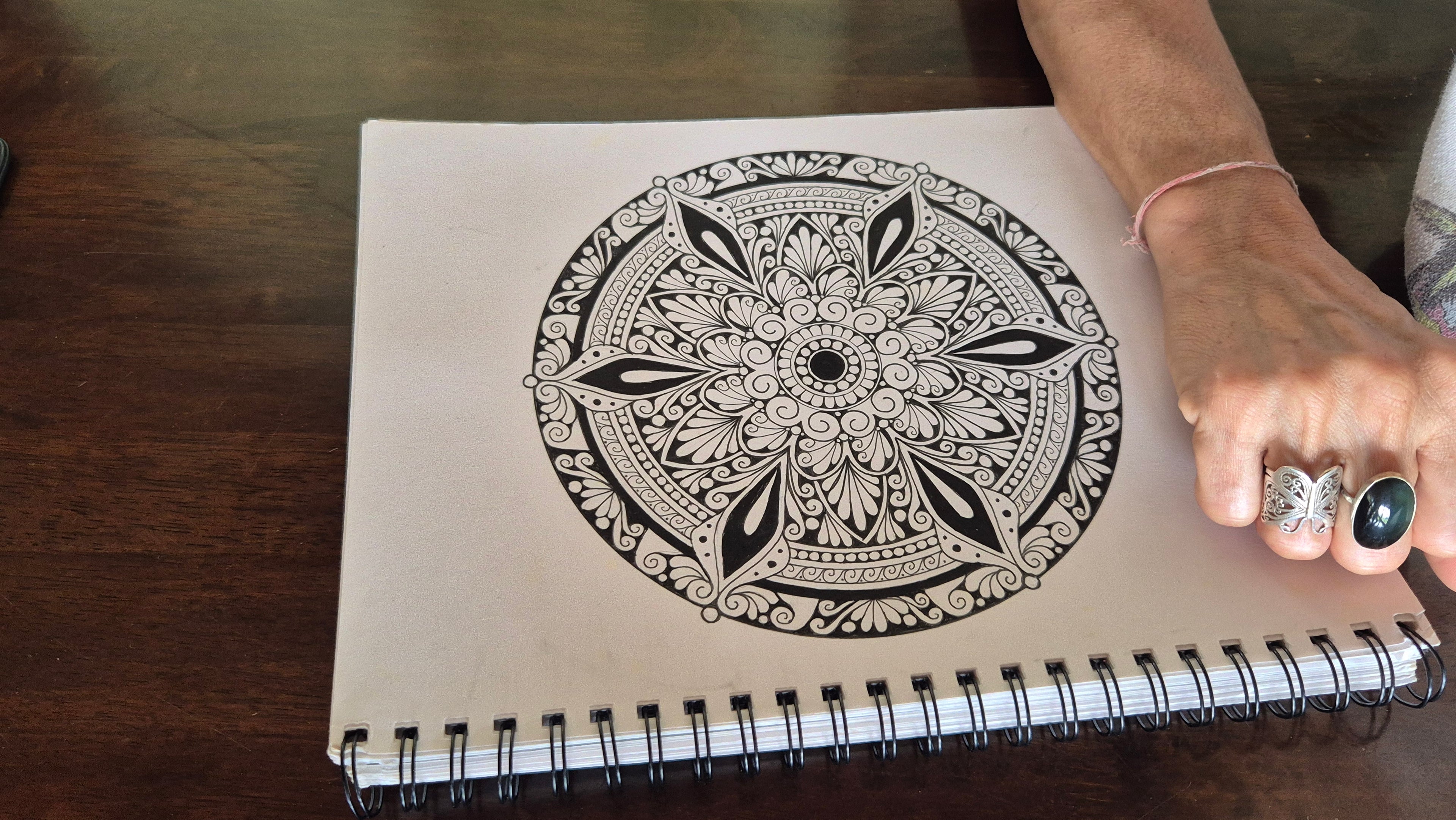 Close-up of hand-drawn mandala design on Yoga Sequence Journal